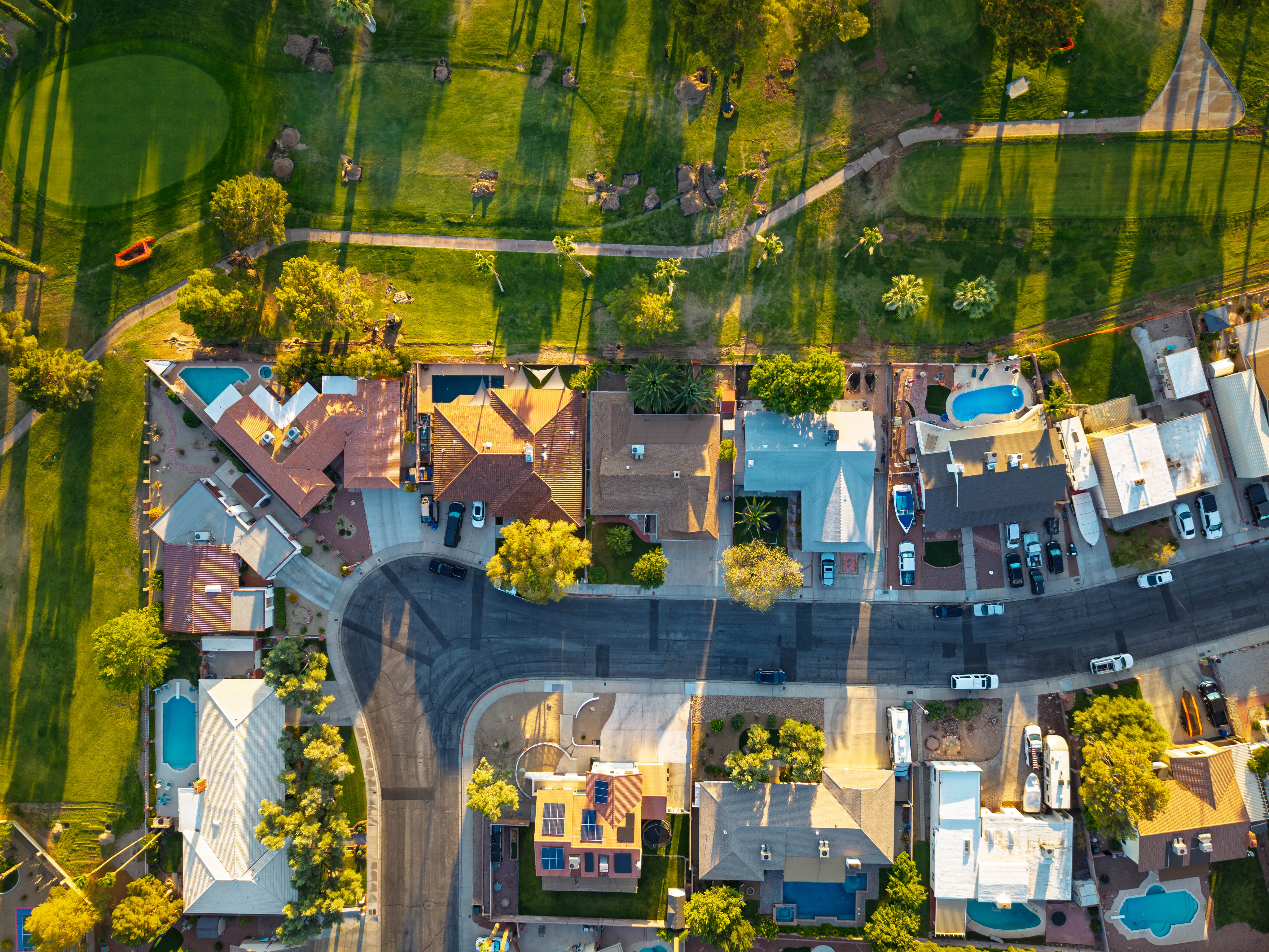 Top-down aerial photo of homes near a golf course